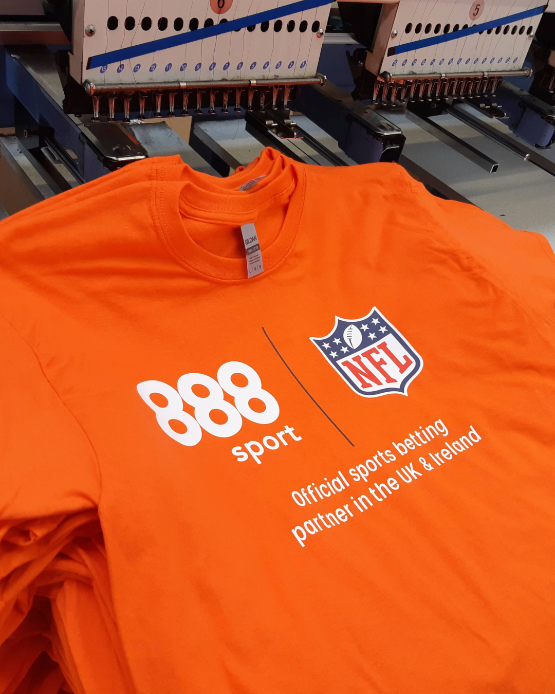 Jumper being embroidered with Gillett Flooring Logo