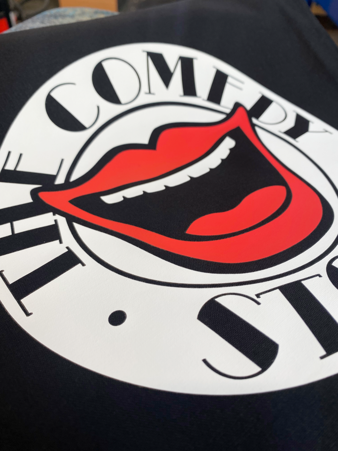 Jumper being embroidered with Gillett Flooring Logo